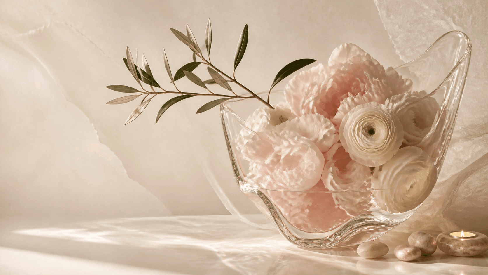 Sculptural vessel of blush flowers